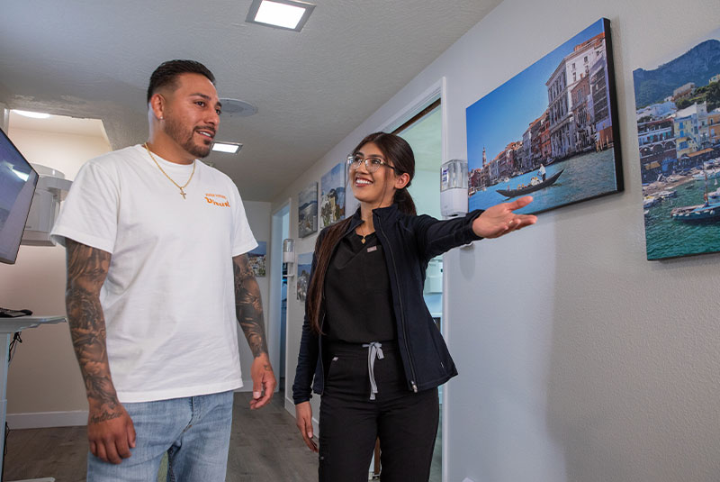 team member walking patient to dental office