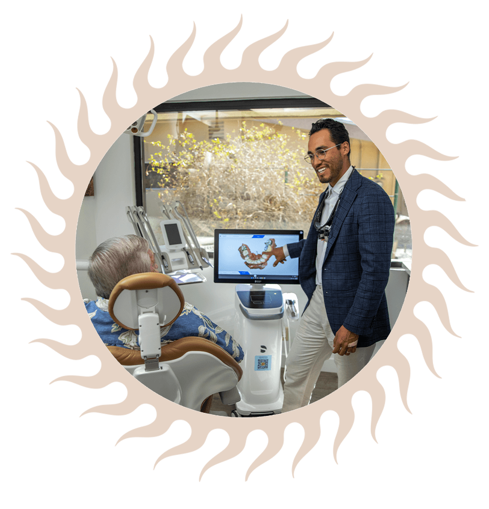 Doctor pointing to 3d scan of patients teeth