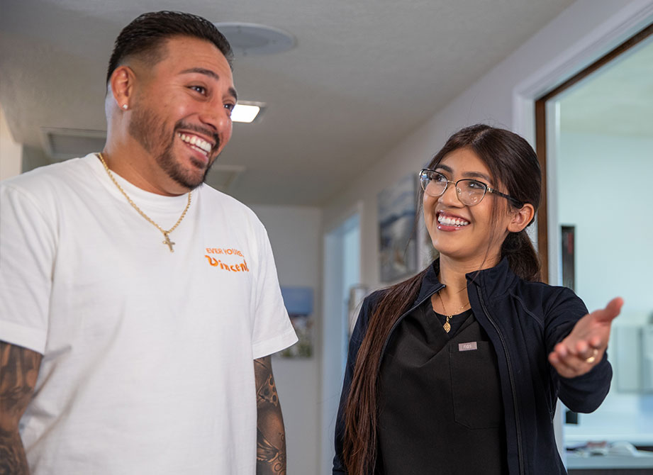 patient and staff member escorting patient for their treatment